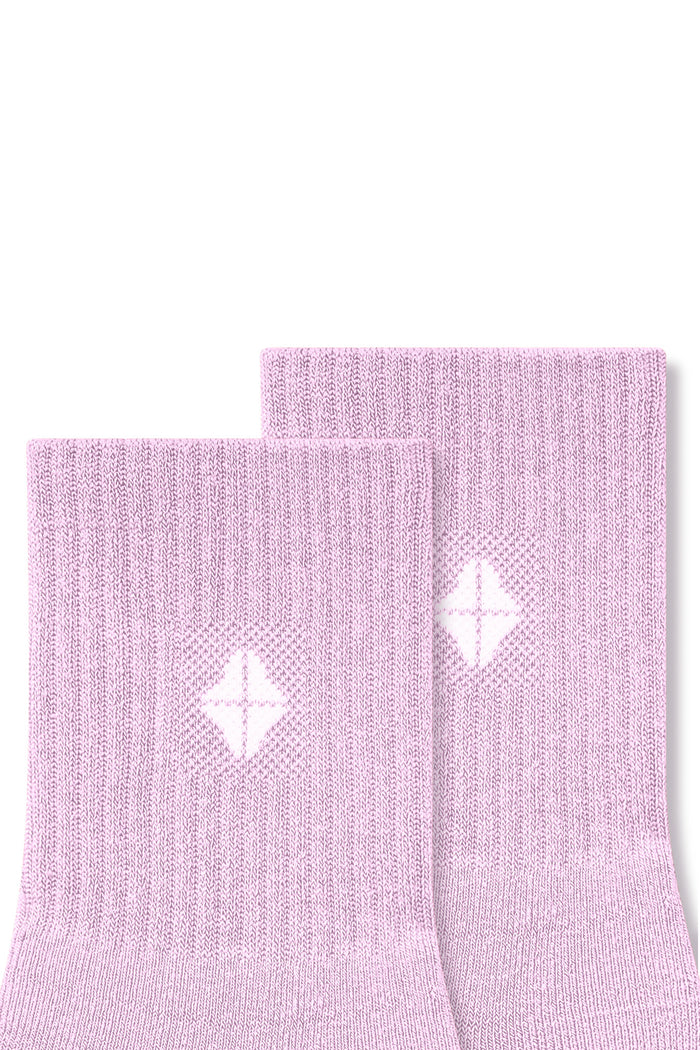 Top part of Adult Crew Socks in Thistle with Kyte Baby logo on a white background