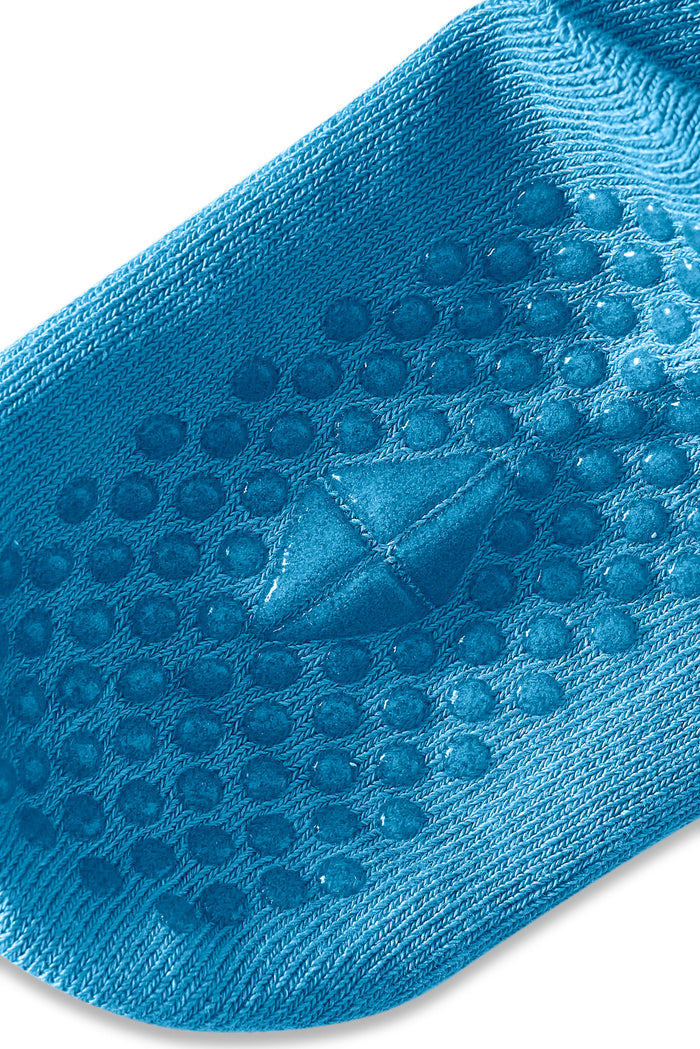 Close up of Quarter Socks in lagoon with grips on a white background