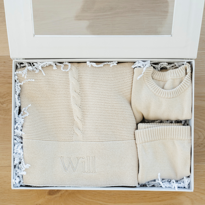Tan baby blanket in heirloom cotton knit bundled with a beautiful matching outfit.