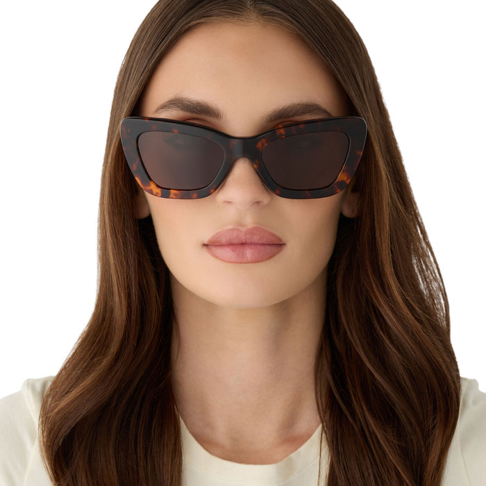 on model - female wearing diff eyewear featuring the adriana cateye sunglasses with a rich tortoise acetate frame and brown lenses front view