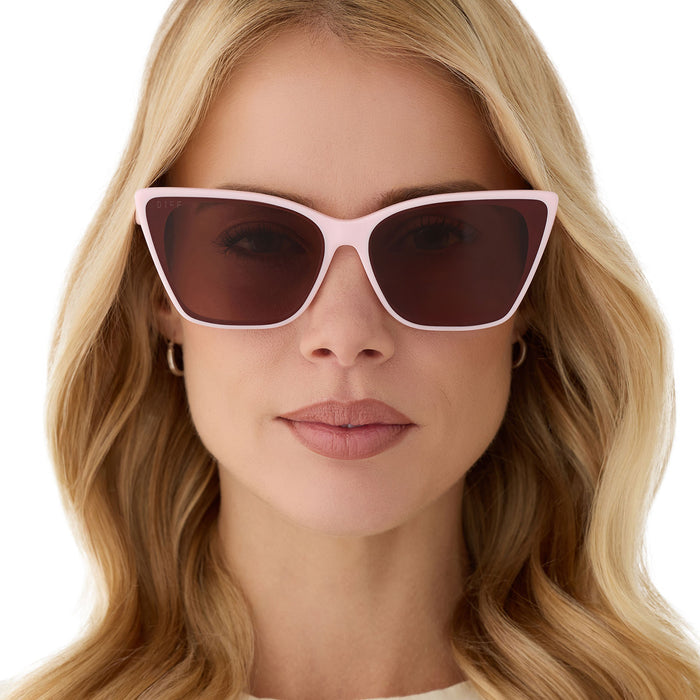 on model - female wearing diff eyewear alina cat eye sunglasses in powder pink acetate and brown lenses front view