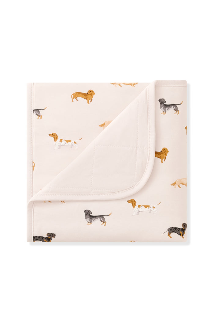 Beige Baby Blanket with Dachshund print on a white background