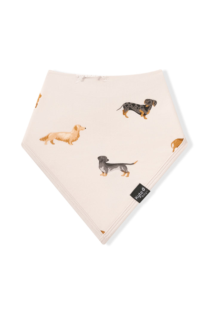 Beige Bib with Dachshund print on a white background
