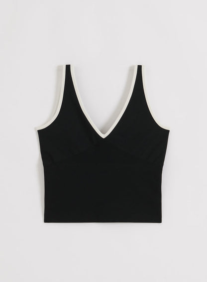 Cream Black aim'n Shape Seamless Deep Cut Singlet featuring a plunging V-neck and contrast trim.