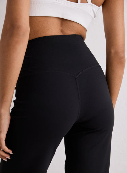 Close-up back view of the Black Sense Straight Leg Petite Tights showing the high waistband and V-shaped stitching
