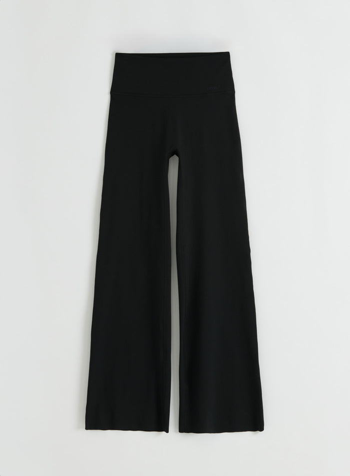 Flatlay of black Sense Straight Leg Petite Tights from aim'n