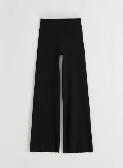 Flatlay of black Sense Straight Leg Petite Tights from aim'n