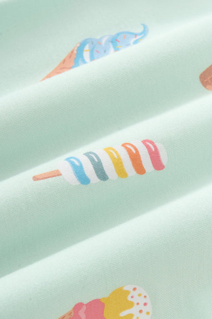 Close up of colorful Ice cream print on green fabric
