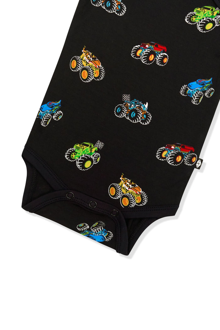 Snap buttons at the bottom of Bodysuit in Monster Truck print on white background