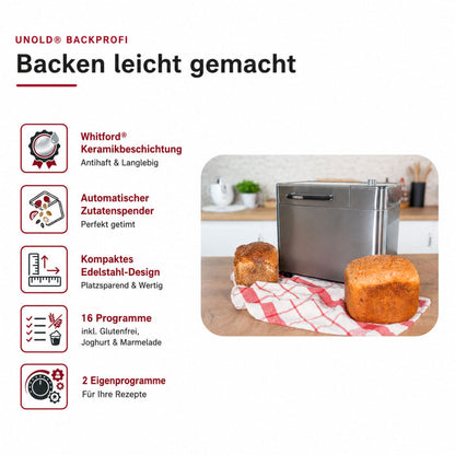 Der Unold Brotbackautomat BackProfi Nussspender inkl.. Rezeptheft steht auf der Theke neben zwei Broten auf einem rot-karierten Tuch. Er verfügt über eine Keramikbeschichtung, einen automatischen Nussspender, kompaktes Design, 16 Programme und 2 anpassbare Optionen.