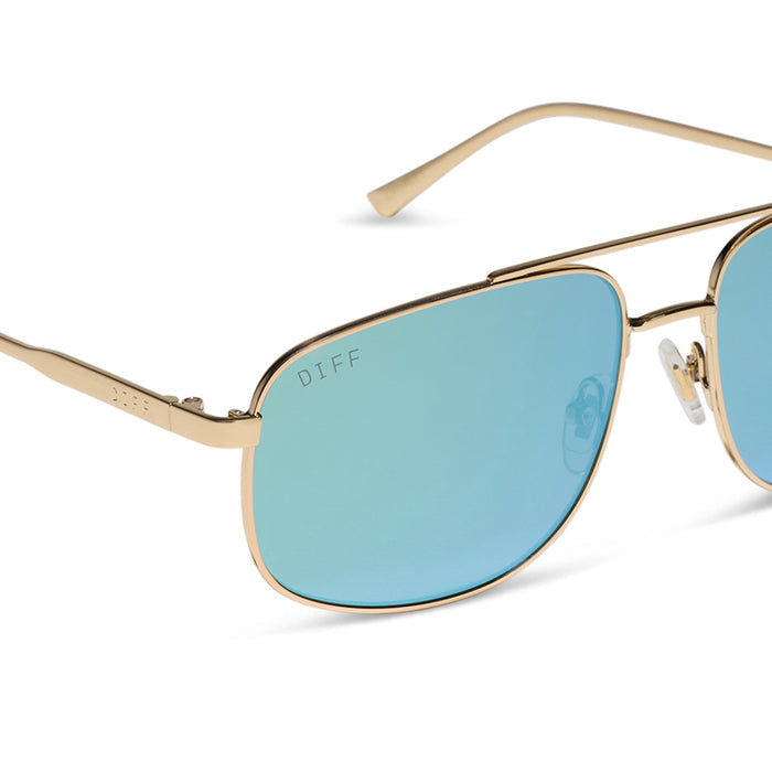 diff eyewear charley navigator sunglasses with a gold metal frame and dew drop blue mirrored lenses detailed view