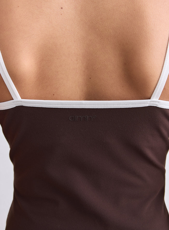 Back view of a chocolate brown Sense Contour Singlet with white straps and a small aim'n logo. [S-165cm]