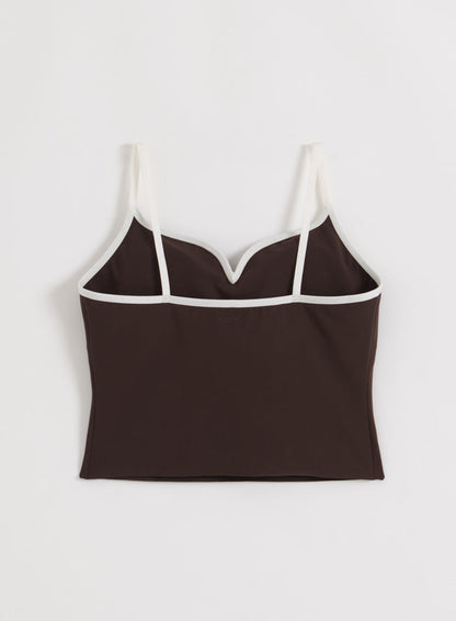 Chocolate Sense Contour Singlet with white contrast trim and thin straps, featuring a second skin feel by aim'n.
