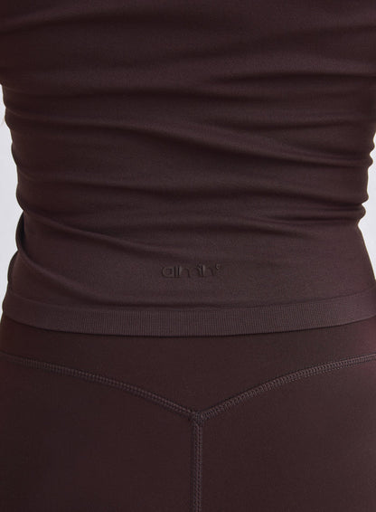 Back view of a chocolate seamless bralette featuring an embossed aim'n logo [XS-165cm]