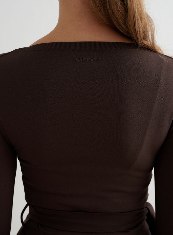 Chocolate brown Shape Seamless Wrap Long Sleeve back detail featuring a subtle aim'n logo.
