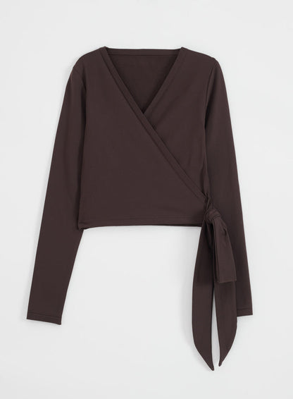 Chocolate Shape Seamless Wrap Long Sleeve top by aim'n with adjustable ties in a flatlay view.