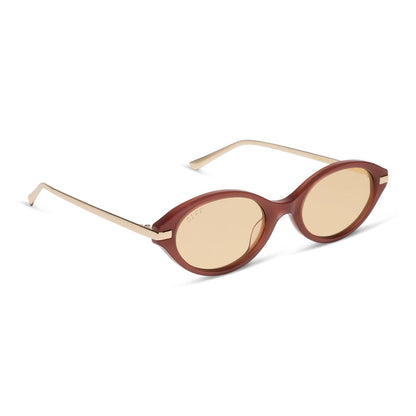 diff eyewear claudine oval sunglasses with a terracotta brown acetate frame, gold metal temples and champagne yellow tint lenses angled view