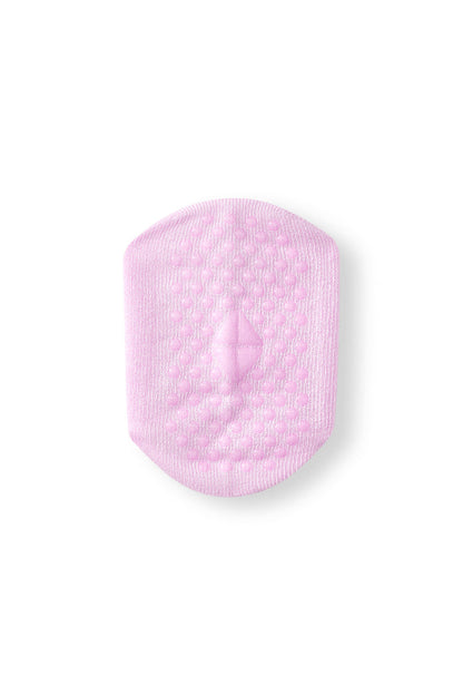 A single light pink textured non-slip sock with rounded corners, shown on a plain white background.