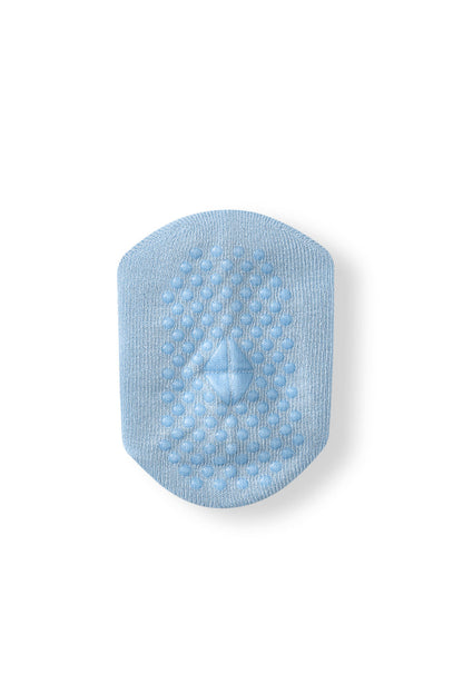 A light blue textured non-slip patch with a central diamond-shaped raised detail, shown on a plain white background.