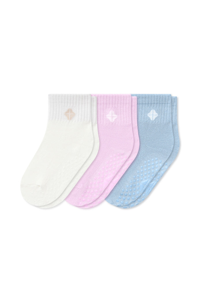 Three pairs of ribbed ankle socks in white, light pink, and light blue, arranged side-by-side on a plain white background.