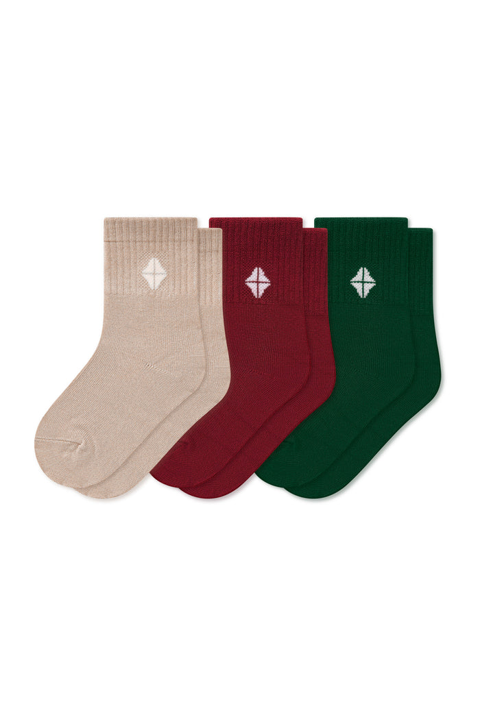 Product photo of the Crew Socks Combo 3-Pack in Holiday set includes: Bisque, Ruby and Forest shown on a white background
