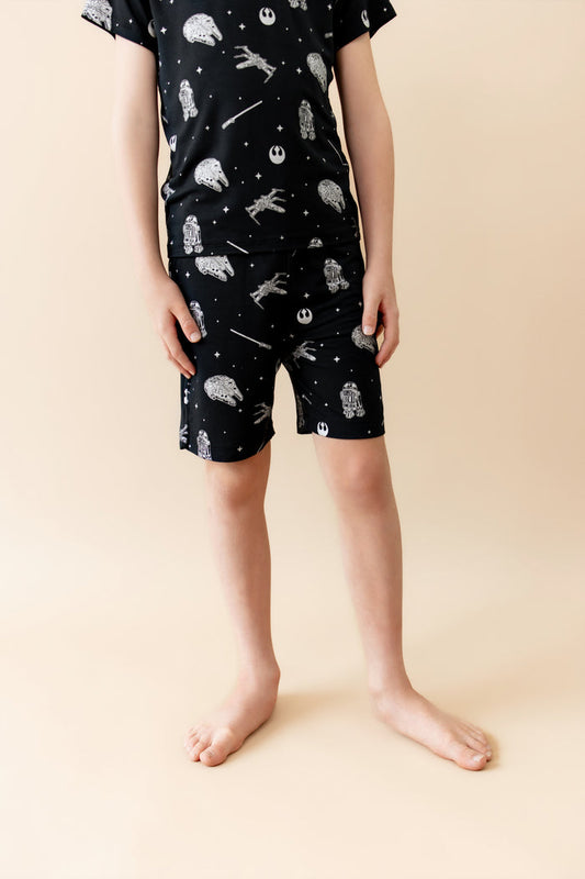 Close up of young boy wearing the Drawstring Short in STAR WARS™ with a matching shirt