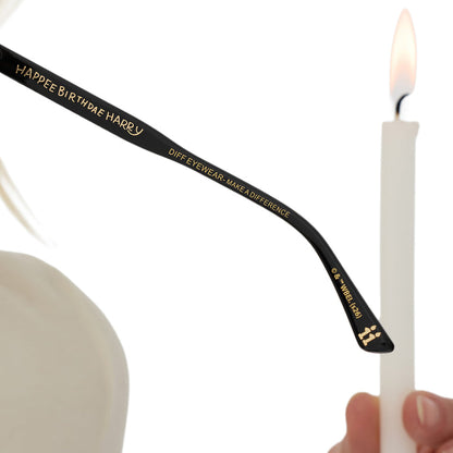 on model - female holding diff eyewear x harry potter birthday round sunglasses detailed temple tip view with candles