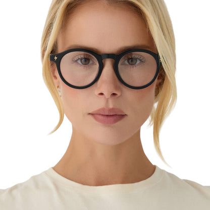 lifestyle - blonde female wearing diff eyewear x harry potter birthday round prescription glasses with a black acetate frame front view
