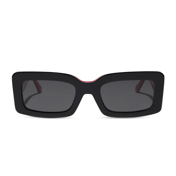 diff eyewear featuring the indy rectangle sunglasses with a black, white & red frame and grey polarized lenses front view