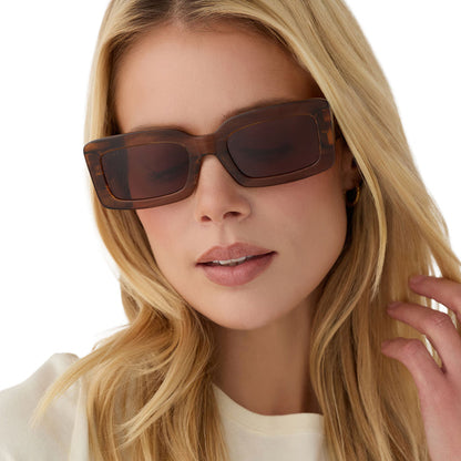 on model - blonde female wearing diff eyewear indy low profile square sunglasses with a tortoise acetate frame and brown lenses front view