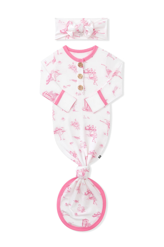 Knotted Gown with Bow Set in Toile Ballet folded with the arms inward on a white background