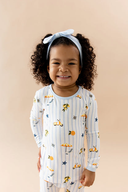 Close up of a young smiling girl wearing the Long Sleeve Pajamas in Amalfi Coast