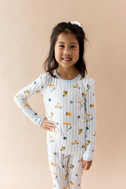 Young girl standing with her hand on her hip wearing the Long Sleeve Pajamas in Amalfi Coast