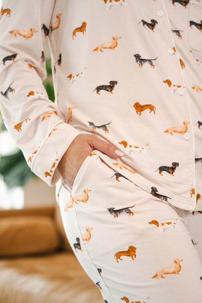 Model showing pockets on Beige Long-Sleeved Women's Pajama Set in Dachshund print