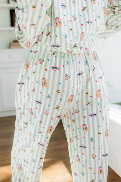 Back side of Long-Sleeved Women's Pajama Set pajamas with colorful Harry Potter patterns on a green and white striped fabric.