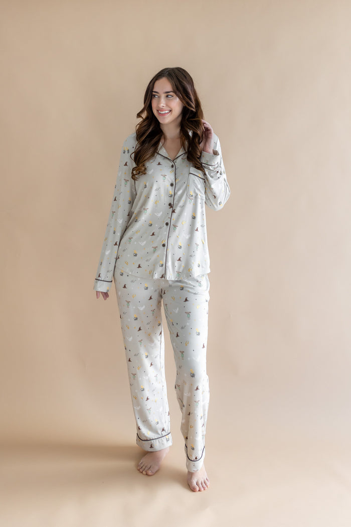 Model wearing a cream Long-Sleeved Women's Pajama Set with Harry Potter prints on a beige background
