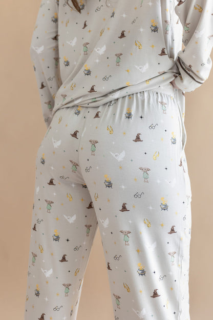Back side of a person wearing a pajama of Long-Sleeved Women's Pajama Set with Harry Potter prints on a beige background.