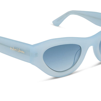 for love & lemons diff eyewear featuring the lucy cat eye sunglasses with a pastel blue acetate frame and blue gradient polarized lenses detailed view