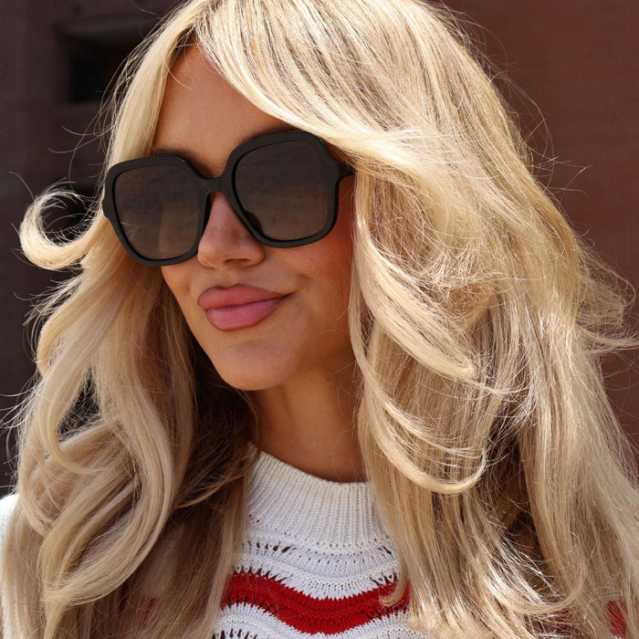 lifestyle - ashley smith blonde wearing oversized black sunglasses