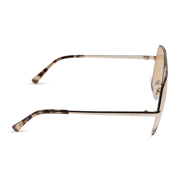 diff eyewear maude oversized aviator sunglasses with a gold metal frame and champagne yellow tint lenses side view