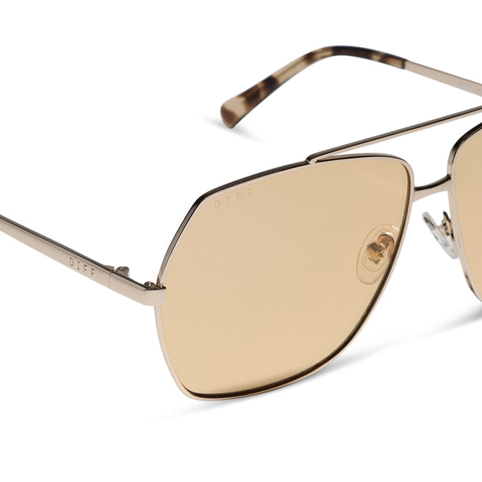 diff eyewear maude oversized aviator sunglasses with a gold metal frame and champagne yellow tint lenses detailed view