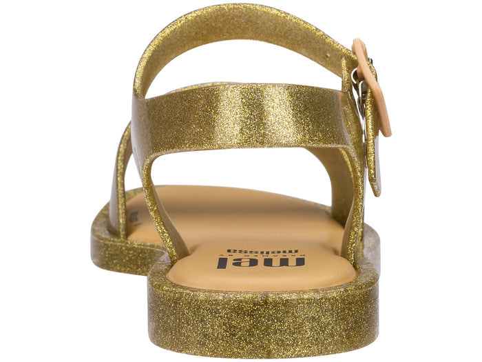 Golden glitter buckle sandals for girls, stylish and comfortable footwear perfect for parties and casual outings.