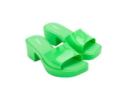 Melissa Shape AD Green Block Heel Slides for Women – Stylish and comfortable slip-on sandals with a trendy block heel, perfect for adding a touch of elegance to any outfit.