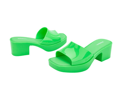 Melissa Shape AD Green Block Heel Slides for Women – Stylish and comfortable slip-on sandals with a trendy block heel, perfect for adding a touch of elegance to any outfit.