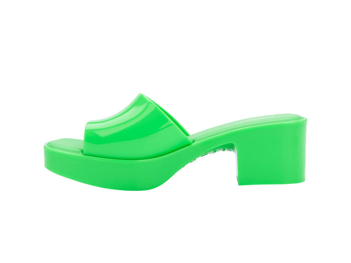 Melissa Shape AD Green Block Heel Slides for Women – Stylish and comfortable slip-on sandals with a trendy block heel, perfect for adding a touch of elegance to any outfit.