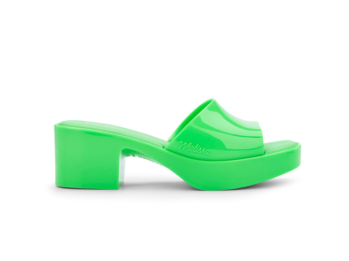 Melissa Shape AD Green Block Heel Slides for Women – Stylish and comfortable slip-on sandals with a trendy block heel, perfect for adding a touch of elegance to any outfit.