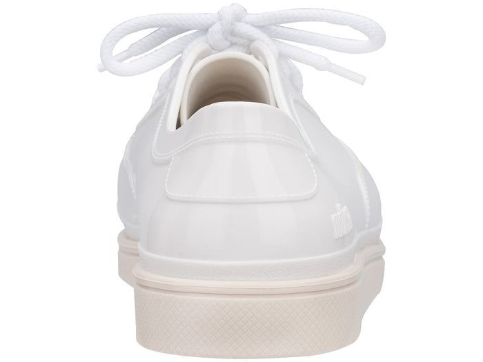 Melissa Line solid white unisex lace-up sneakers with a sleek design and comfortable fit for versatile everyday wear