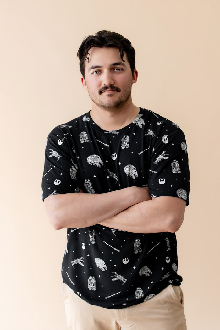 Male modeling the Men's Crew Neck Tee in STAR WARS™ with his arms crossed in front of him