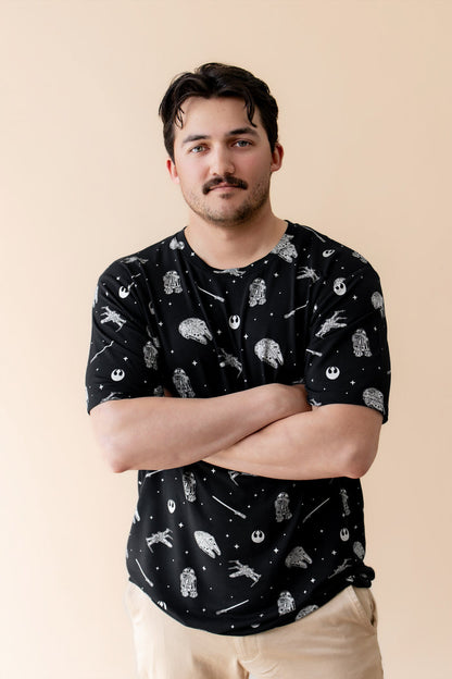 Male modeling the Men's Crew Neck Tee in STAR WARS™ with his arms crossed in front of him