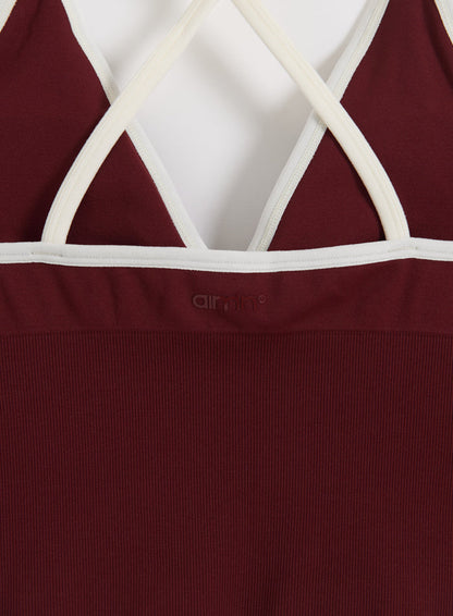 Merlot cross-back bralette with white straps and ribbed seamless fabric, featuring a tonal aim'n logo.